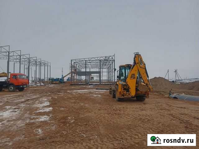 Аренда экскаватора погрузчика с гидромолотом Астрахань - изображение 1